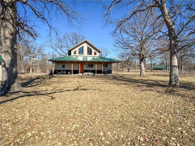 country-style home featuring metal roof