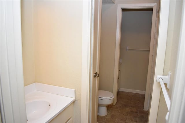 bathroom featuring sink and toilet