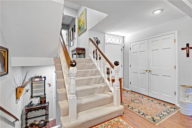 entryway featuring stairs and wood finished floors