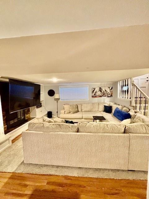 living room featuring hardwood / wood-style floors and built in features