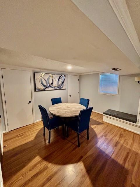 dining space featuring hardwood / wood-style flooring