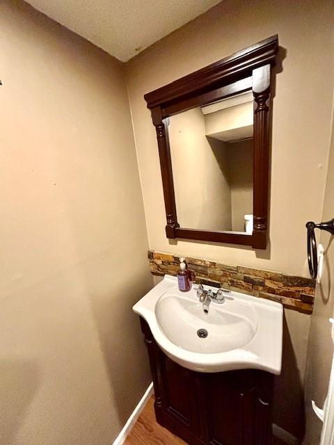 bathroom featuring vanity and hardwood / wood-style floors