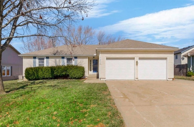 single story home featuring a front lawn, concrete driveway, and a garage