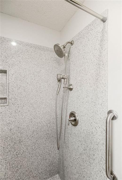 details with a textured ceiling and walk in shower