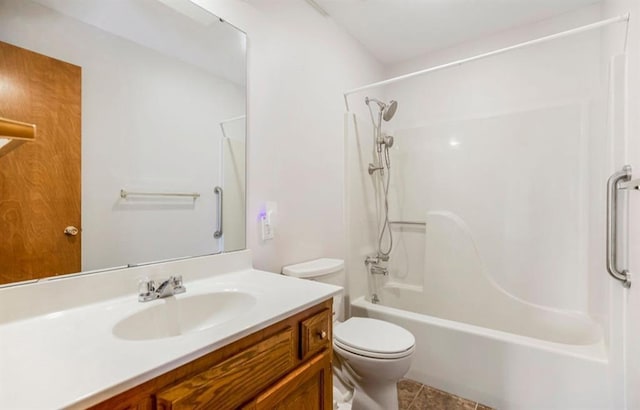 bathroom featuring vanity, tile patterned floors, toilet, and shower / washtub combination