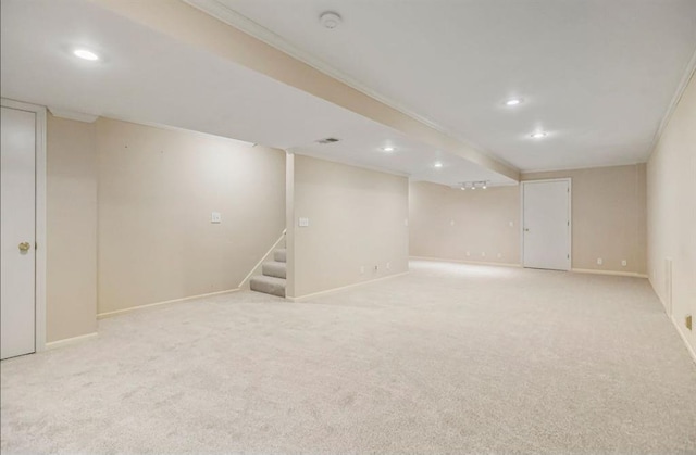 finished below grade area with recessed lighting, baseboards, light carpet, and stairs