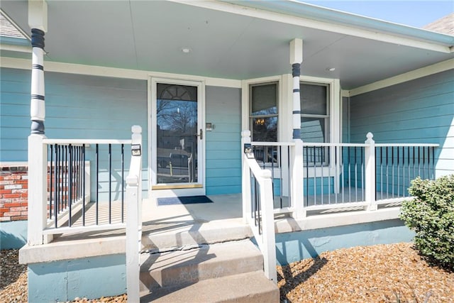 property entrance featuring covered porch