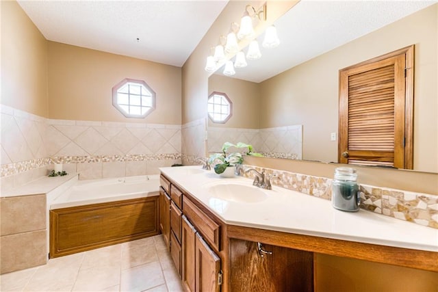 bathroom with tile patterned flooring, a garden tub, double vanity, and a sink