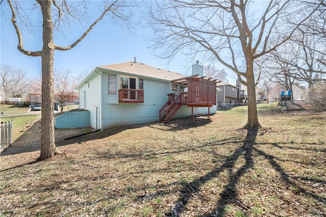 back of property featuring stairway and fence