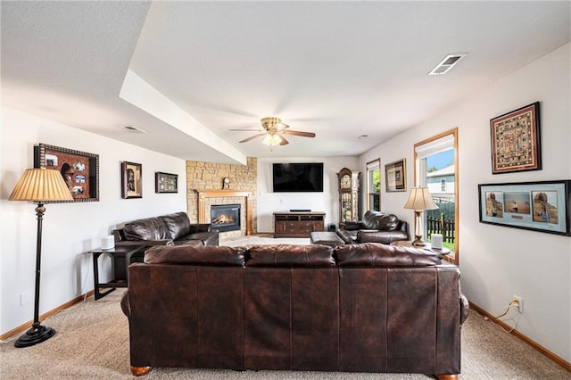 living area featuring baseboards, carpet floors, and a ceiling fan