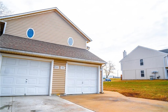 garage with concrete driveway