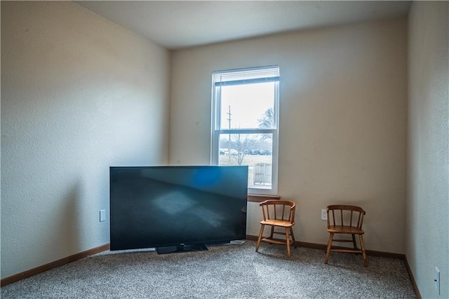 unfurnished room featuring carpet flooring and baseboards