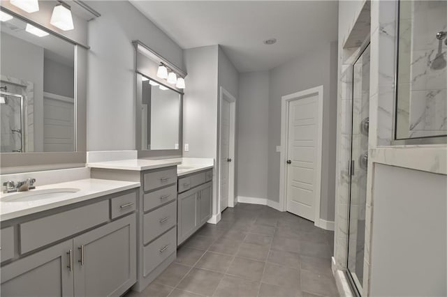 bathroom featuring vanity, tile patterned floors, and a shower with shower door