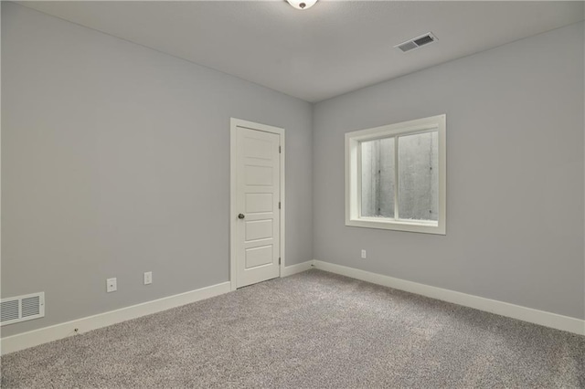 unfurnished room featuring carpet