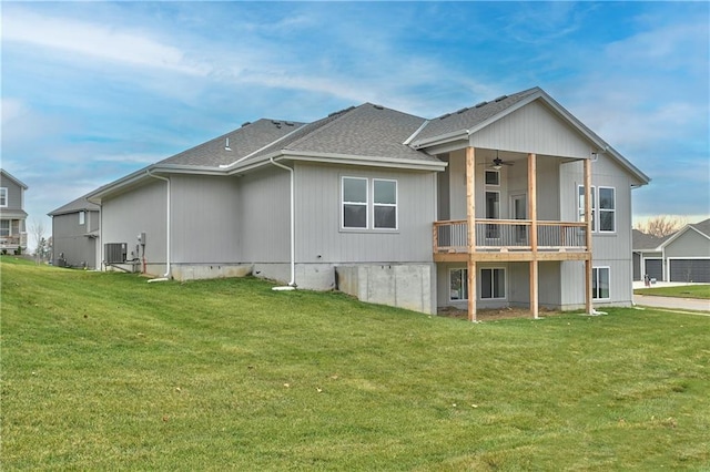 back of house featuring a yard, cooling unit, and ceiling fan