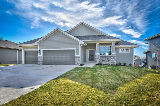 craftsman house with a garage and a front yard