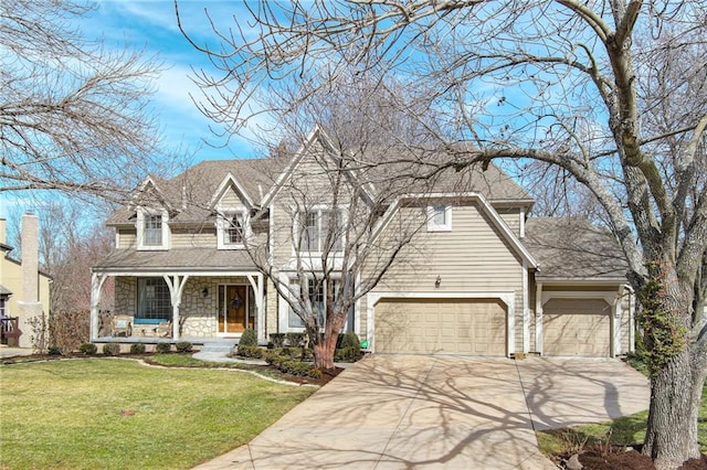 view of front of house featuring a shingled roof, a porch, concrete driveway, a front yard, and stone siding