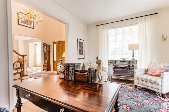 dining area with a chandelier, stairway, and ornamental molding