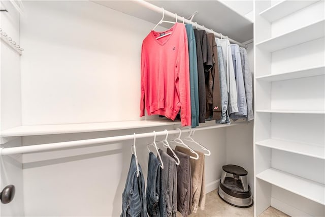 walk in closet with tile patterned flooring