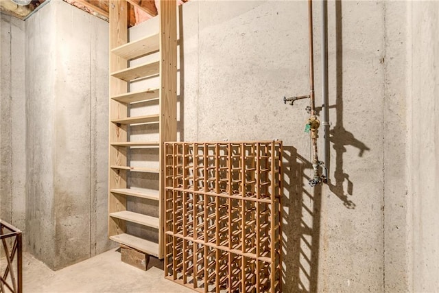 wine area featuring concrete flooring