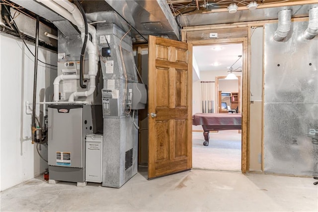 utility room featuring heating unit