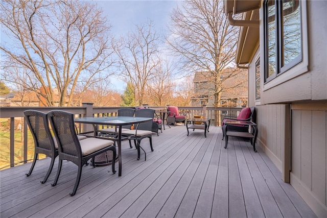 deck featuring outdoor dining area