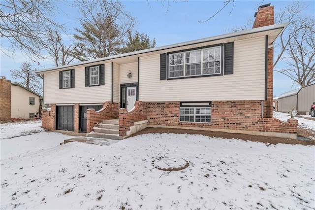 split foyer home featuring a garage