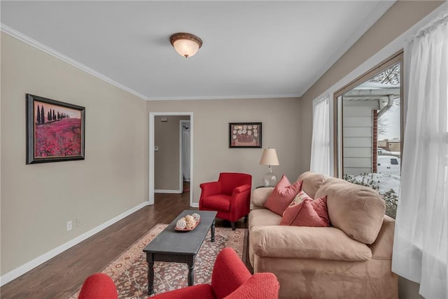 living room featuring dark wood-type flooring, crown molding, and baseboards