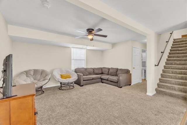 living room with ceiling fan and carpet flooring