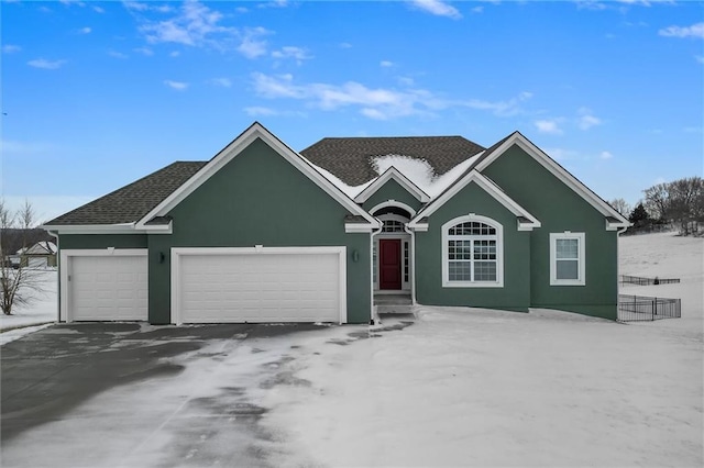 ranch-style home featuring a garage, roof with shingles, and stucco siding