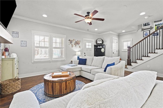 living room with ornamental molding, dark wood finished floors, baseboards, and stairs