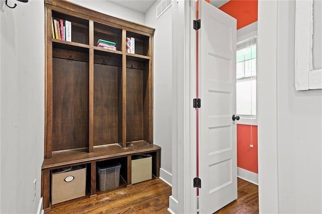 mudroom featuring visible vents and dark wood finished floors