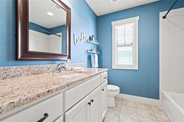 bathroom featuring visible vents, toilet, vanity, tile patterned flooring, and baseboards