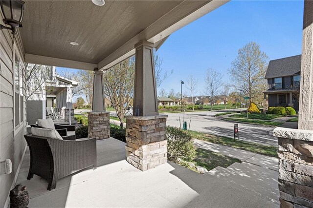 9011 NE 79th St, Kansas City, MO 64158 - view of patio / terrace with a residential view and a porch