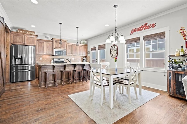 9011 NE 79th St, Kansas City, MO 64158 - dining area with ornamental molding, recessed lighting, and visible vents