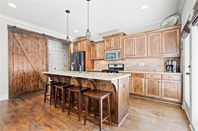 9011 NE 79th St, Kansas City, MO 64158 - kitchen with stainless steel appliances, backsplash, and ornamental molding