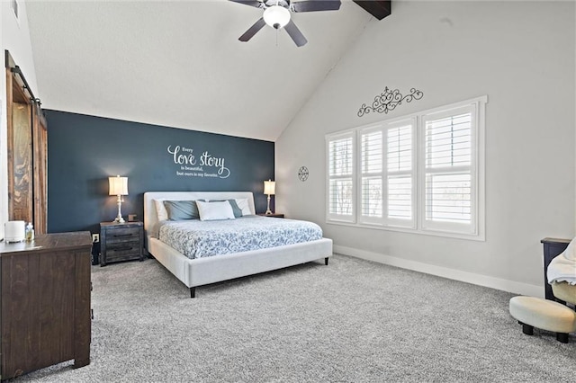 9011 NE 79th St, Kansas City, MO 64158 - bedroom featuring a barn door, baseboards, carpet flooring, and high vaulted ceiling