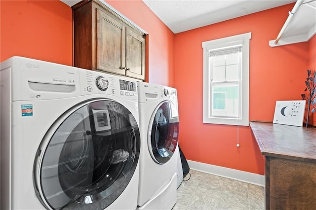 9011 NE 79th St, Kansas City, MO 64158 - laundry area featuring separate washer and dryer, baseboards, and cabinet space