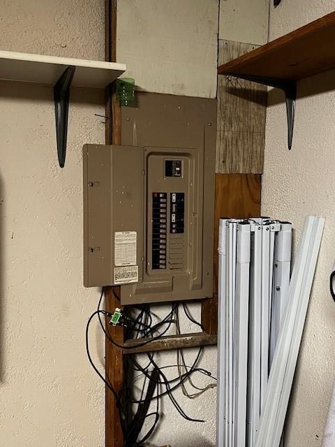 utility room featuring electric panel