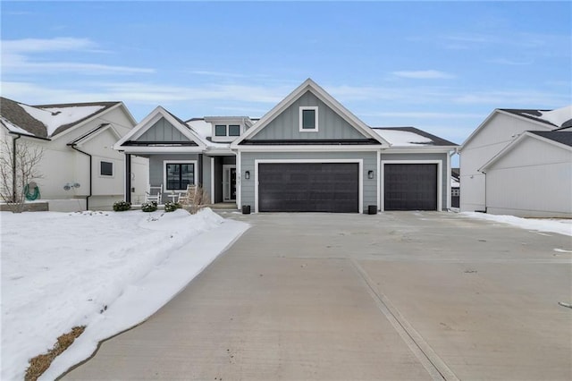 view of front of home with a garage and a porch