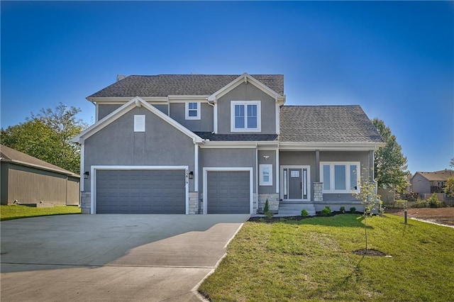 view of front of home featuring a garage and a front yard