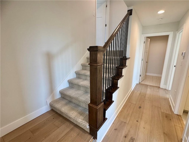 stairway with wood-type flooring