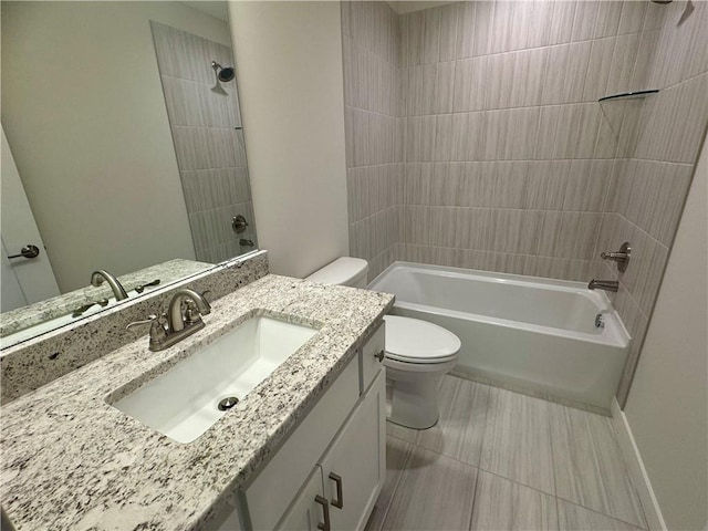 full bathroom with tiled shower / bath combo, vanity, and toilet