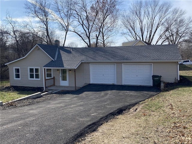 ranch-style house featuring a garage