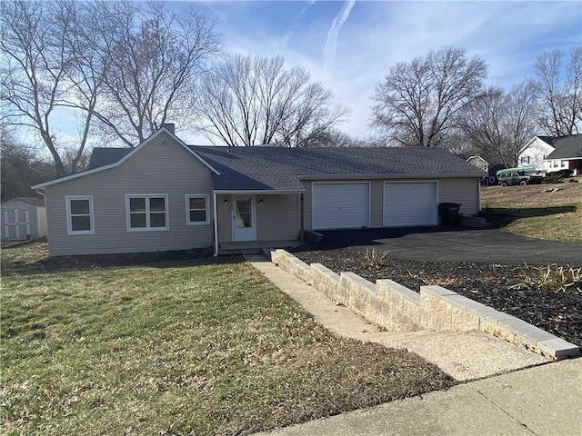 single story home with a garage and a front yard