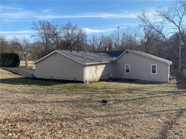 view of property exterior featuring a yard