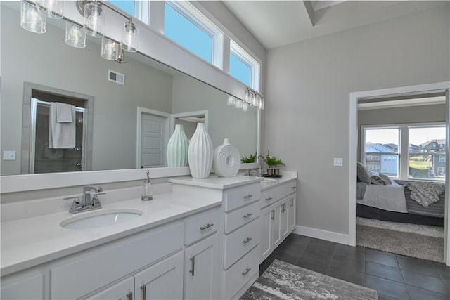 full bath featuring a wealth of natural light, tile patterned flooring, visible vents, and a sink