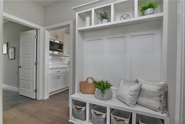 mudroom featuring dark wood-style flooring