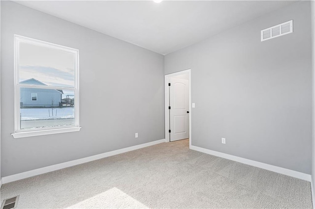 9630 N Colrain Ave, Kansas City, MO 64154 - spare room with carpet floors, baseboards, and visible vents