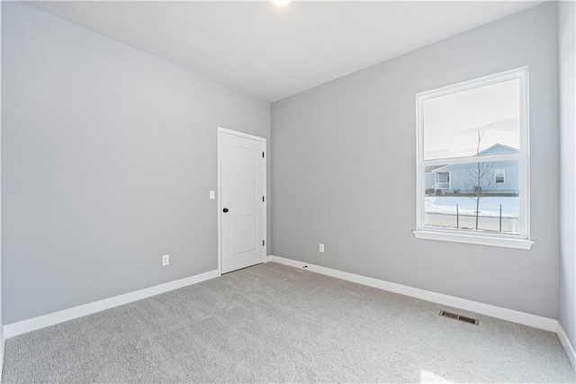 9630 N Colrain Ave, Kansas City, MO 64154 - carpeted spare room with baseboards and visible vents
